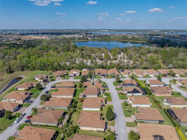 drone / aerial view featuring a water view and a residential view