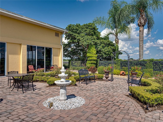 view of patio featuring fence