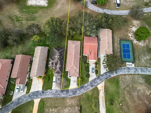 birds eye view of property with a residential view