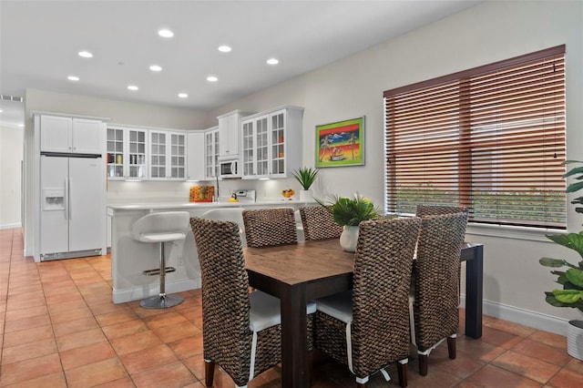 dining space with recessed lighting, visible vents, baseboards, and light tile patterned floors