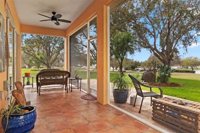 sunroom with a ceiling fan