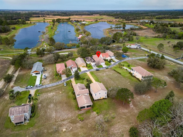 bird's eye view with a water view and a residential view