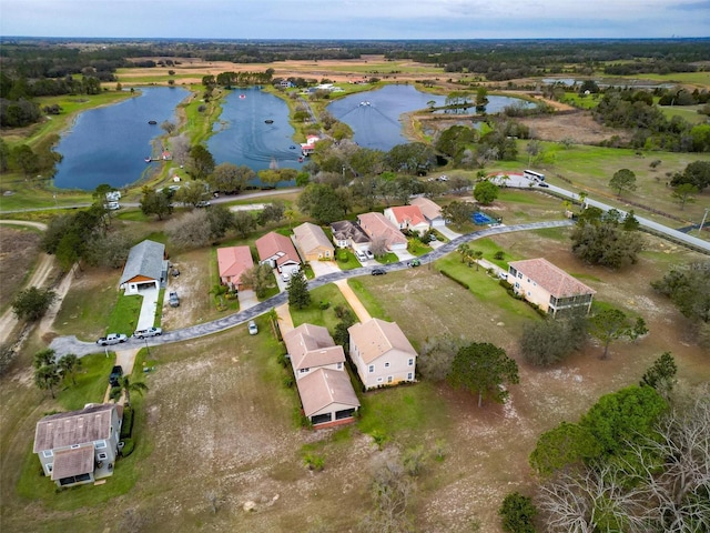 bird's eye view with a water view and a residential view