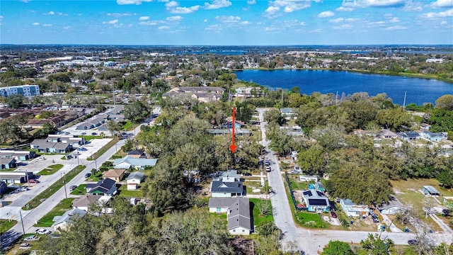 birds eye view of property with a water view and a residential view