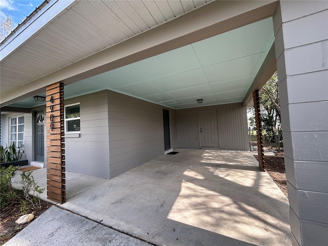 view of patio / terrace featuring an attached carport