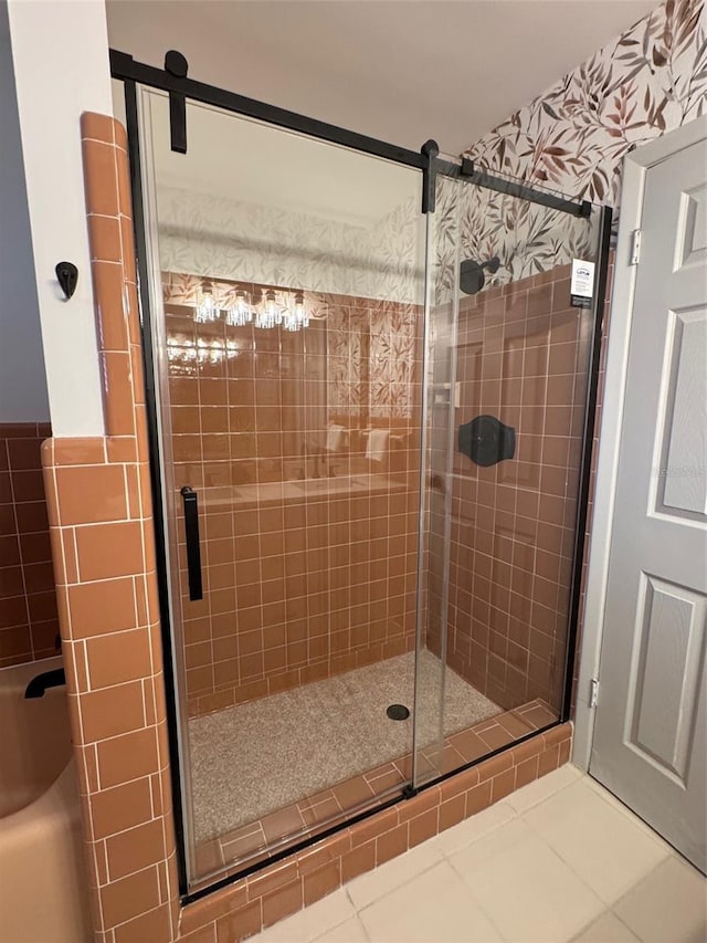 bathroom featuring a stall shower, tile patterned flooring, and tile walls