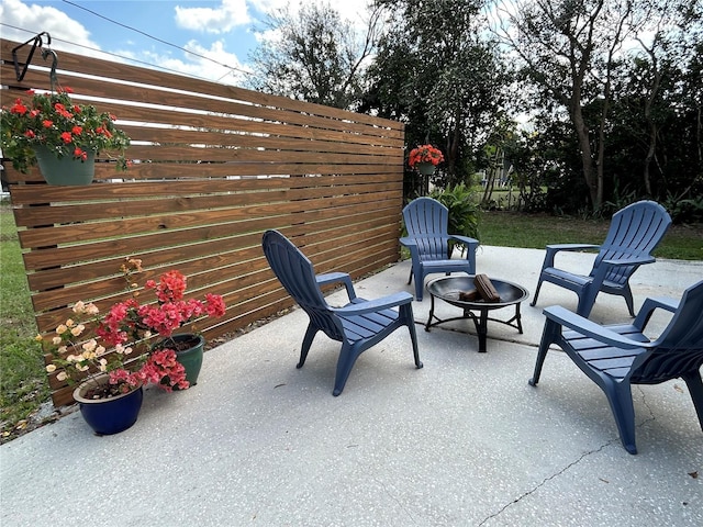 view of patio with a fire pit