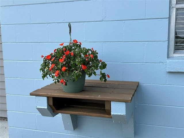 exterior details featuring concrete block siding