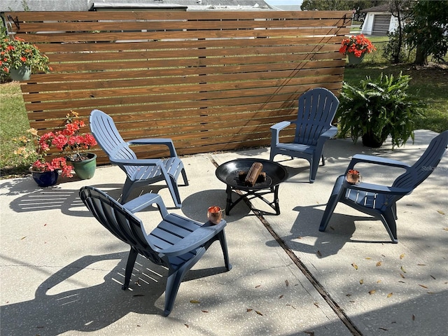 view of patio featuring a fire pit