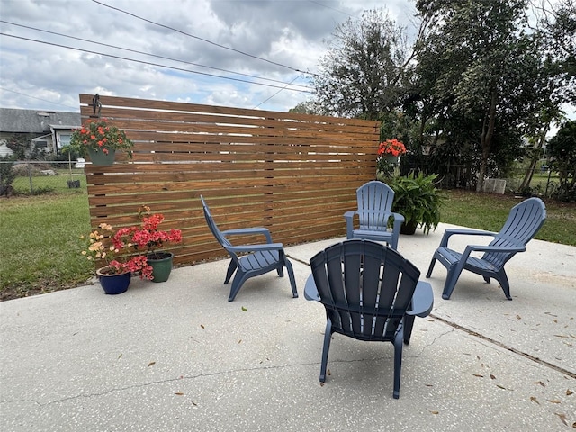 view of patio featuring fence