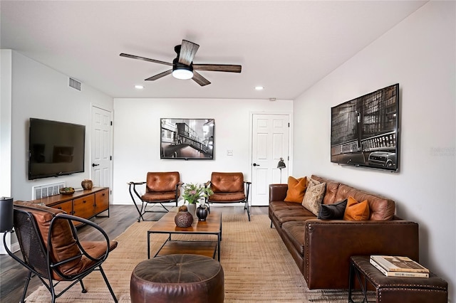 living room with recessed lighting, visible vents, ceiling fan, and wood finished floors