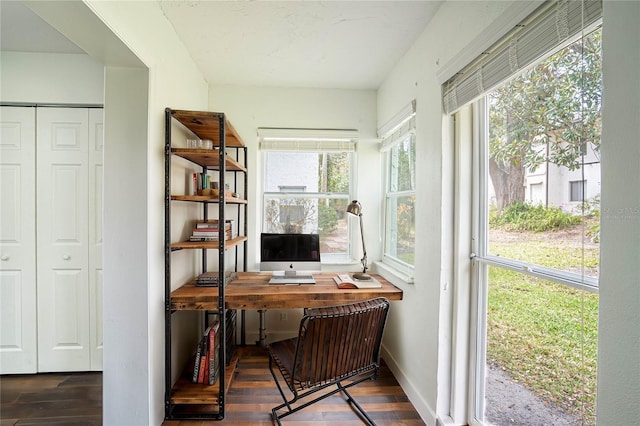 office space featuring baseboards and dark wood-type flooring