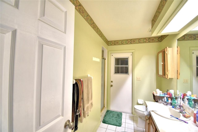 full bathroom with toilet, a stall shower, tile patterned flooring, and vanity