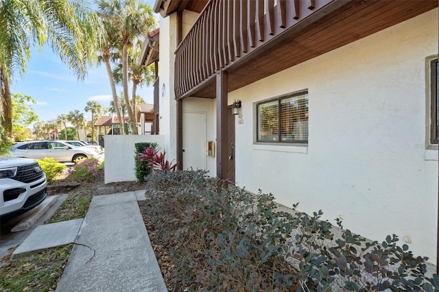 view of side of property featuring stucco siding