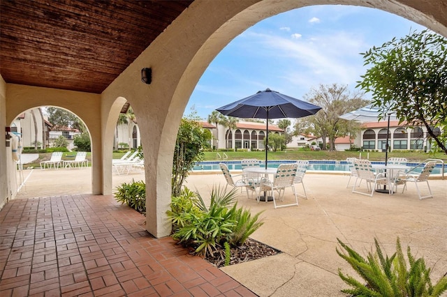 view of patio / terrace featuring a community pool