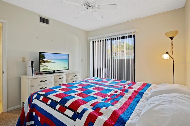 carpeted bedroom featuring baseboards, visible vents, ceiling fan, access to outside, and a textured ceiling