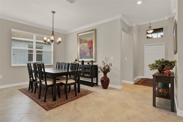 dining space featuring an inviting chandelier, baseboards, ornamental molding, and light tile patterned flooring