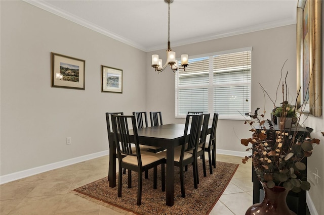 dining area featuring a notable chandelier, baseboards, crown molding, and light tile patterned flooring