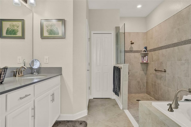 full bathroom featuring a garden tub, tile patterned flooring, vanity, baseboards, and walk in shower