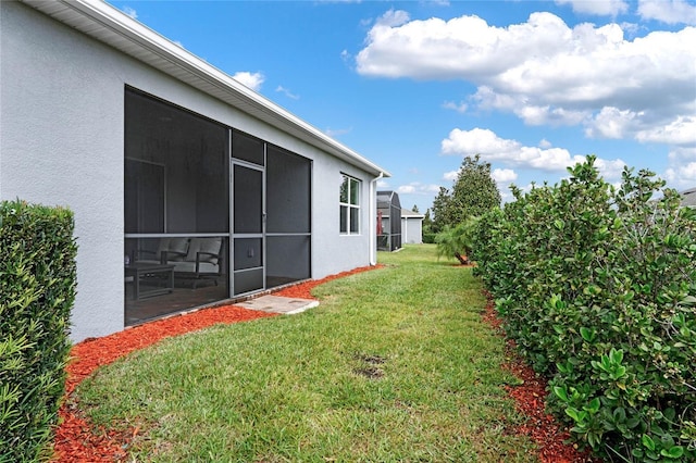 view of yard featuring a sunroom