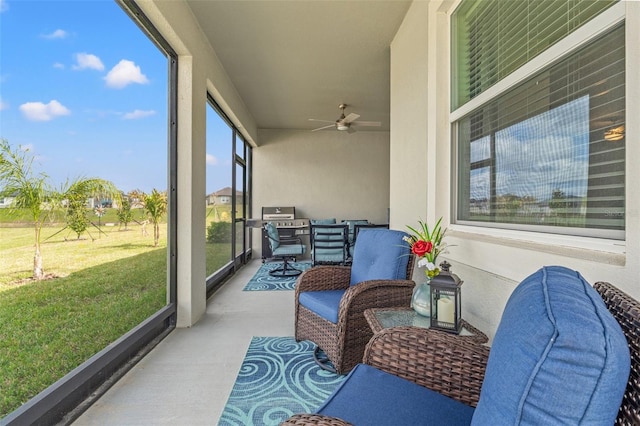 sunroom with a ceiling fan