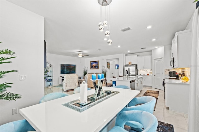 dining area featuring ceiling fan, visible vents, and recessed lighting