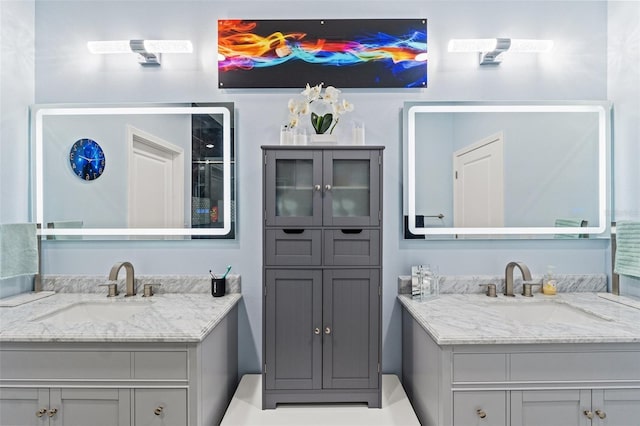 full bathroom with two vanities and a sink