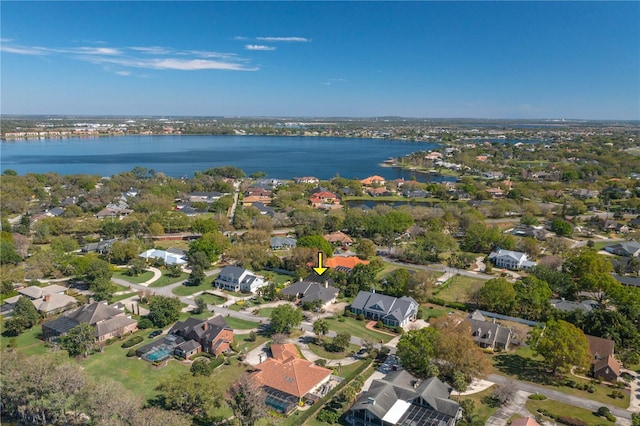 bird's eye view featuring a residential view and a water view