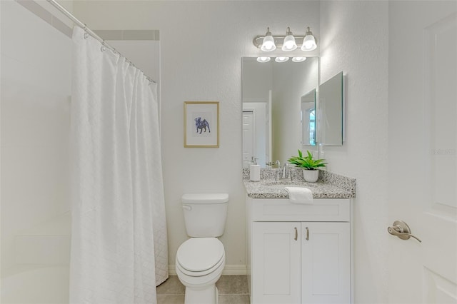 bathroom with toilet, vanity, baseboards, a shower with curtain, and tile patterned floors