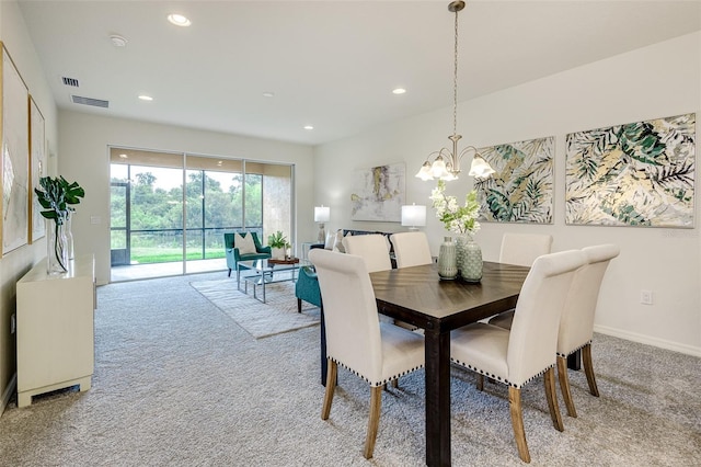 dining room with recessed lighting, visible vents, and light colored carpet