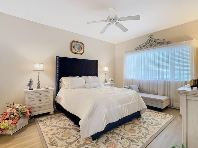 bedroom featuring a ceiling fan and light wood-type flooring