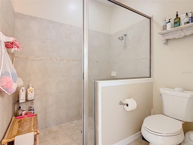 full bath with a shower stall and toilet