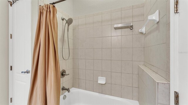 full bath featuring shower / bathtub combination with curtain