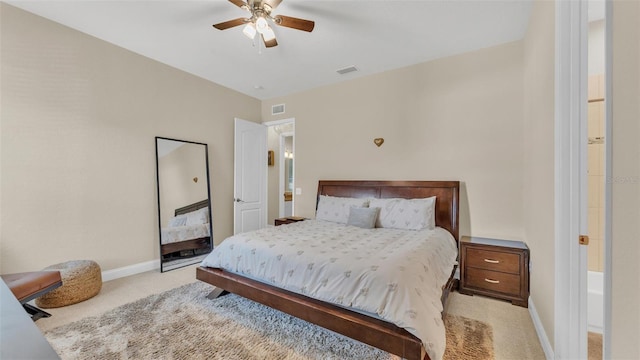 carpeted bedroom with a ceiling fan, visible vents, and baseboards