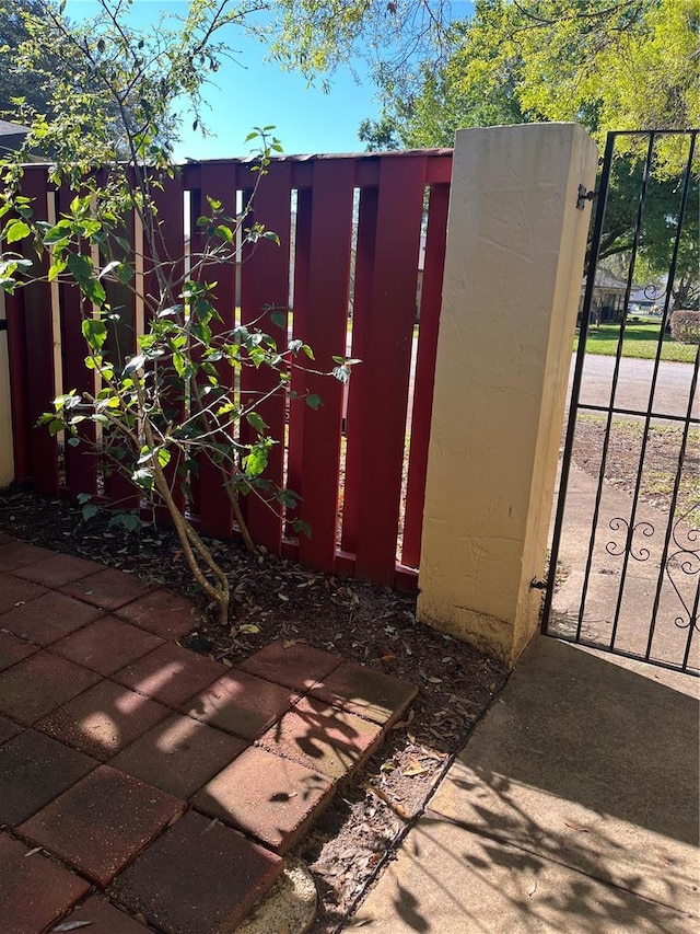 view of gate featuring fence