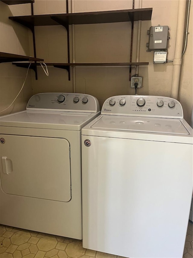 clothes washing area with laundry area and washing machine and clothes dryer