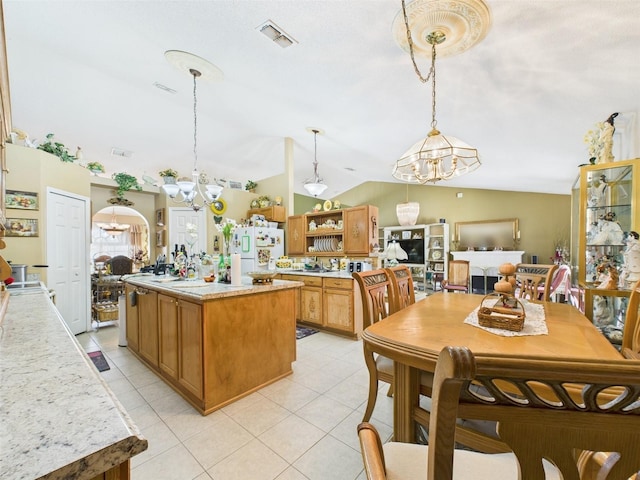 kitchen featuring visible vents, open shelves, light countertops, and freestanding refrigerator