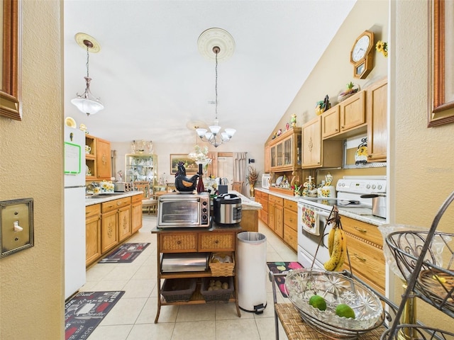 kitchen with light countertops, white appliances, a toaster, and light tile patterned flooring