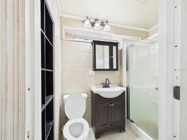 bathroom with toilet, crown molding, a shower stall, and vanity