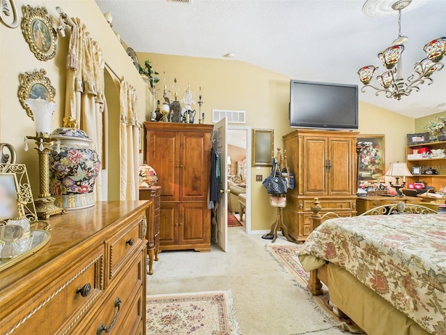 bedroom with lofted ceiling, visible vents, and light carpet