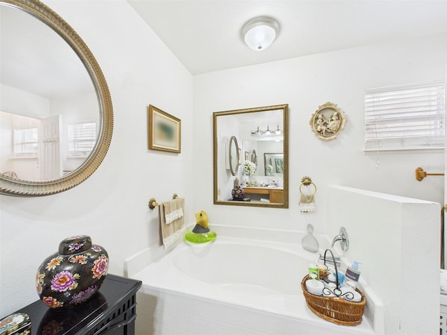 bathroom with a garden tub