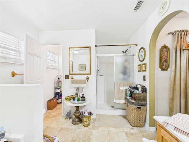 full bath featuring a stall shower, visible vents, and tile patterned floors