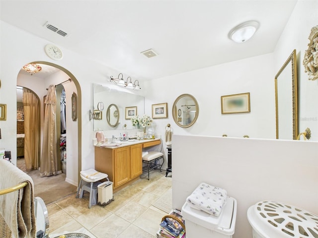 bathroom featuring vanity, tile patterned flooring, and visible vents