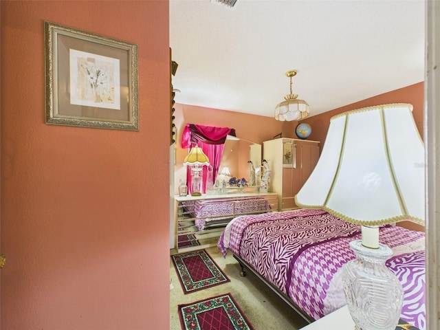 carpeted bedroom featuring visible vents