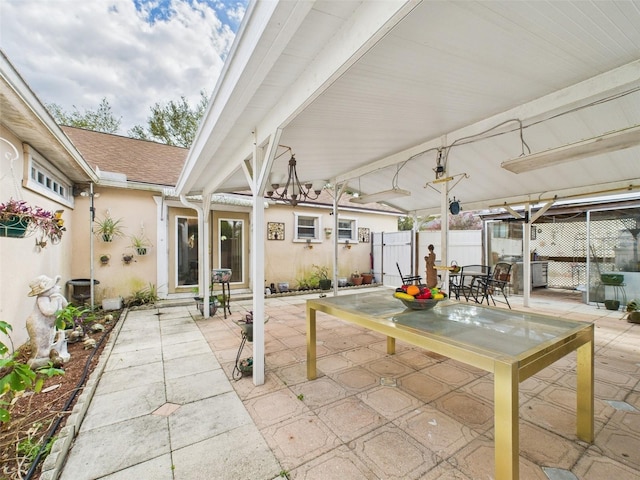 view of patio featuring fence