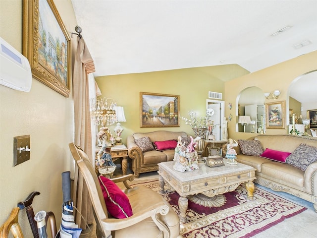 living room featuring vaulted ceiling, arched walkways, and visible vents