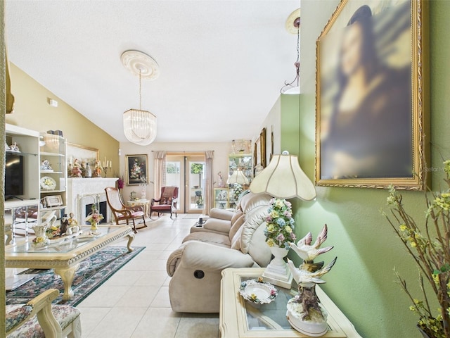 living area featuring vaulted ceiling, a fireplace, a chandelier, and light tile patterned flooring