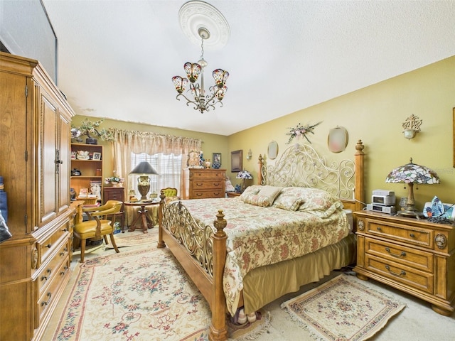 bedroom with light carpet and a chandelier