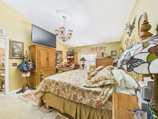 bedroom with visible vents, baseboards, vaulted ceiling, carpet, and an inviting chandelier