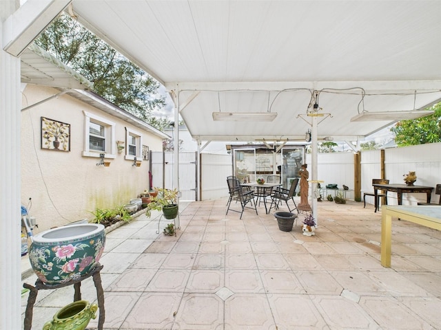 view of patio / terrace with outdoor dining area and fence